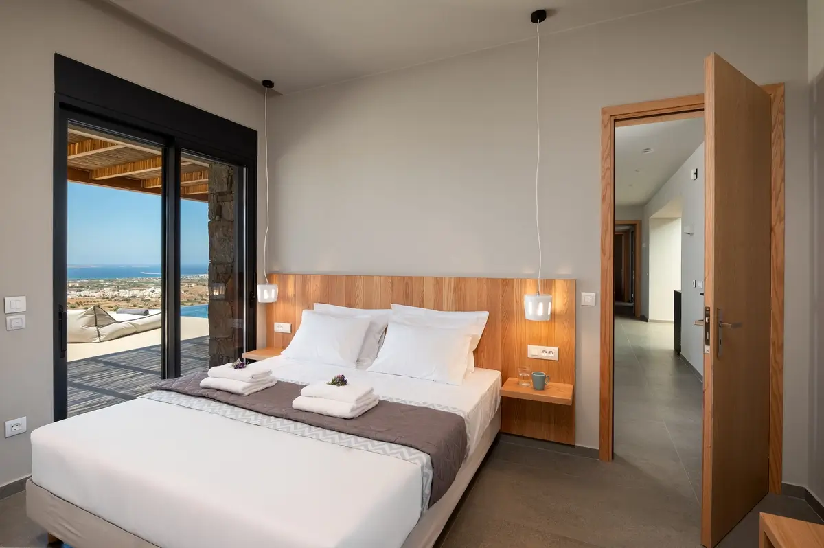 King size bed inside a bedroom of the villa
